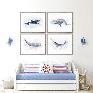 a bedroom with a bed and four pictures on the wall
