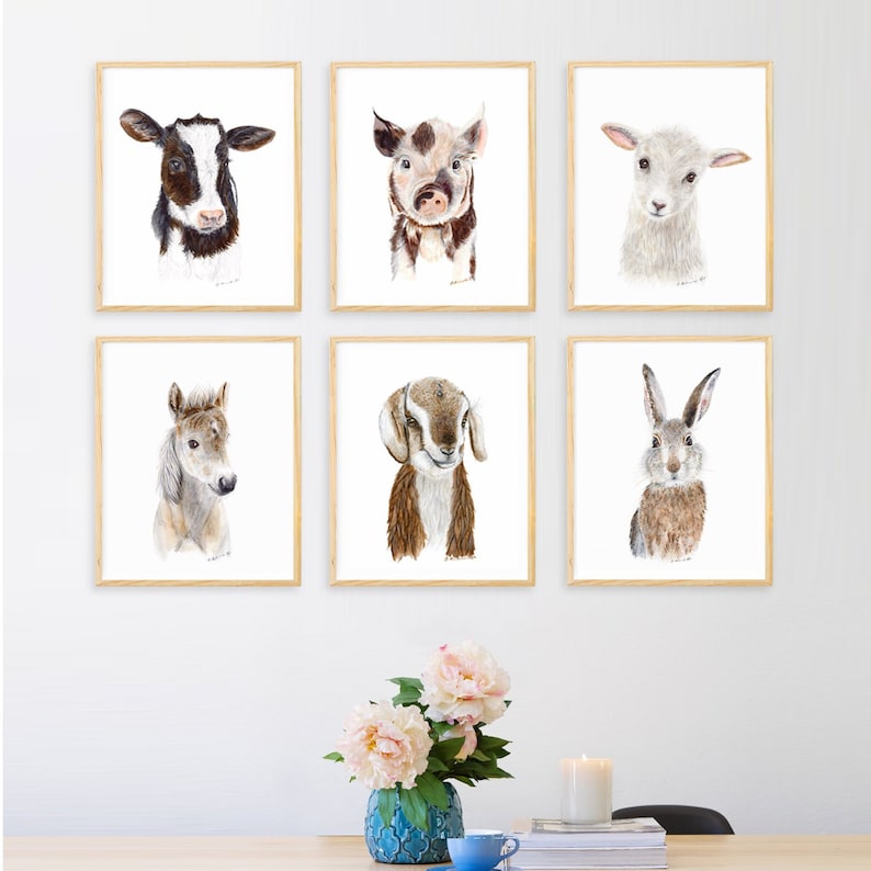 May include: A set of six framed animal illustrations, each featuring a different animal: a cow, a pig, a lamb, a horse, a goat, and a rabbit. The illustrations are all done in a watercolour style and are set against a white background.