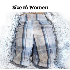 May include: Blue and white plaid shorts with a size 16 label.