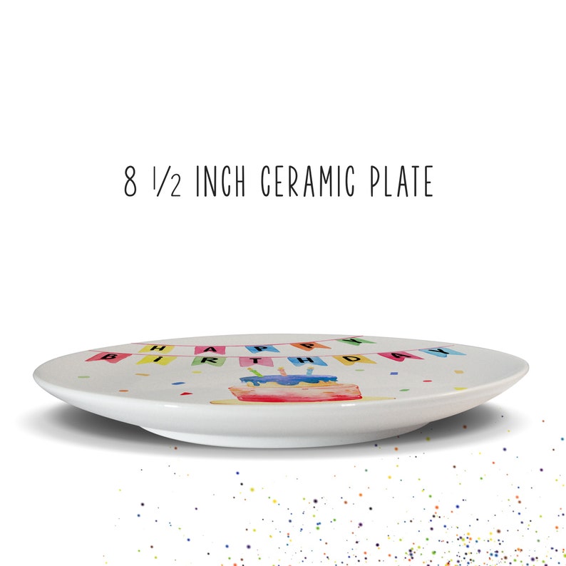 May include: White ceramic plate, 8.5 inches in diameter, with a colorful watercolor design. The plate features a birthday cake and a banner that reads "HAPPY BIRTHDAY". Confetti dots are scattered around the plate.