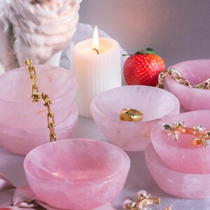 Natural rose quartz trinket dish with polished finish, ideal for crystal lovers or as a Valentine’s Day gift.