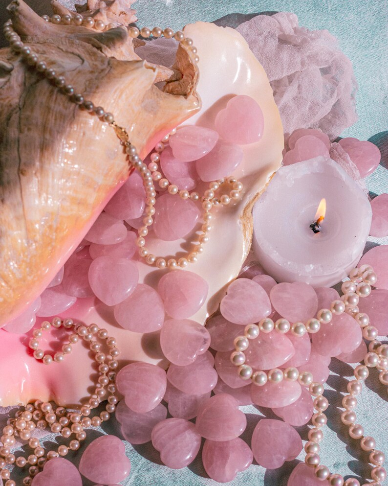Natural polished rose quartz heart palm stone, perfect for holding, carrying, or gifting for Valentine’s Day.