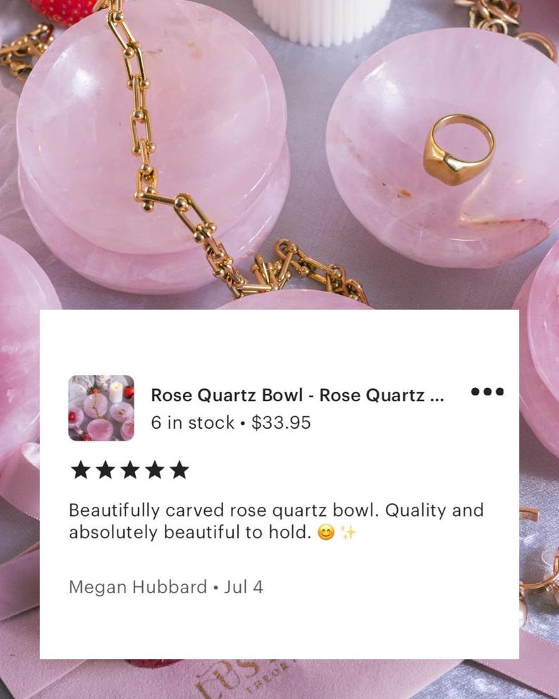 Stone trinket dish for jewelry made of prink rose quartz crystal.
