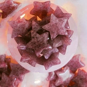 Set of strawberry quartz stars in rosy hues, perfect for collectors or energy work — these shimmering crystals promote love, balance, and gentle positive energy.