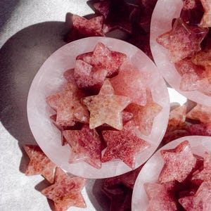 Beautiful strawberry quartz crystal stars with soft pink sparkle, perfect for gifting, crystal grids, or adding a touch of love energy to your home or workspace décor