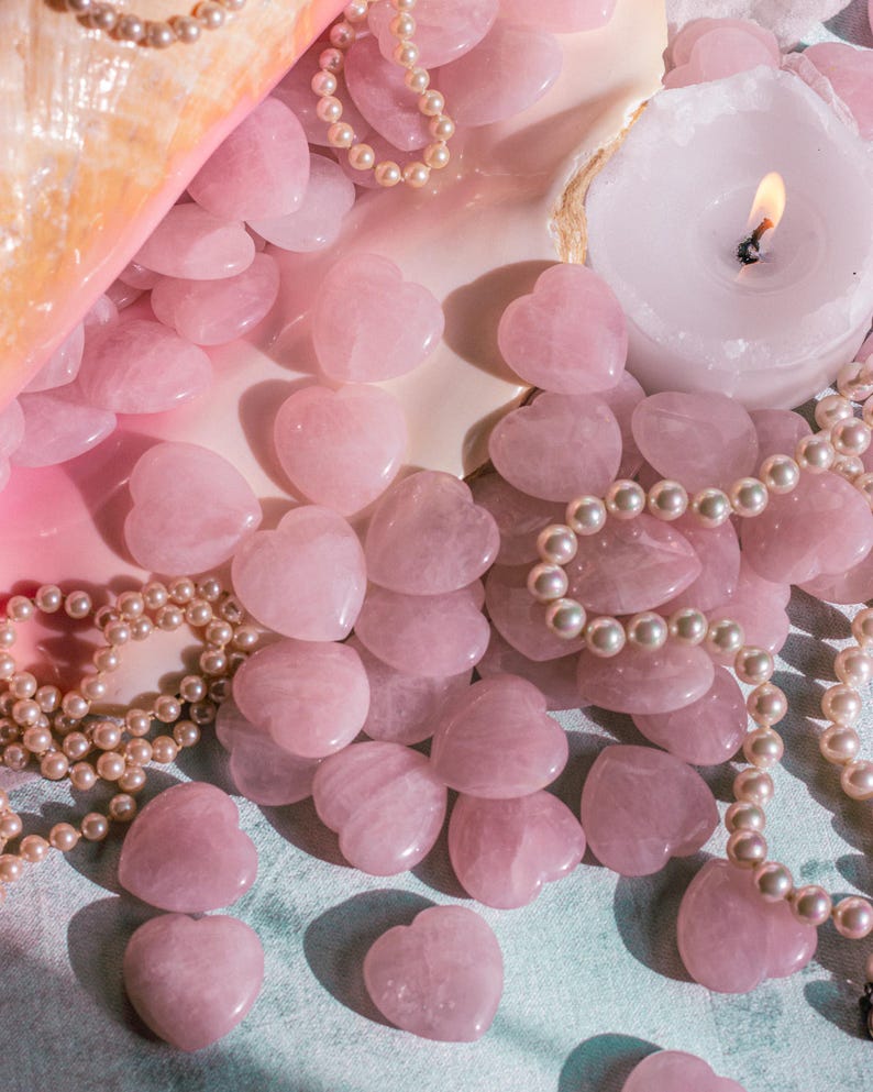 Carved rose quartz heart worry stone, naturally polished, perfect for carrying in your pocket or gifting.