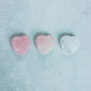 Hand-polished rose quartz heart, ideal as a palm stone for mindfulness, self-care, or crystal collections.