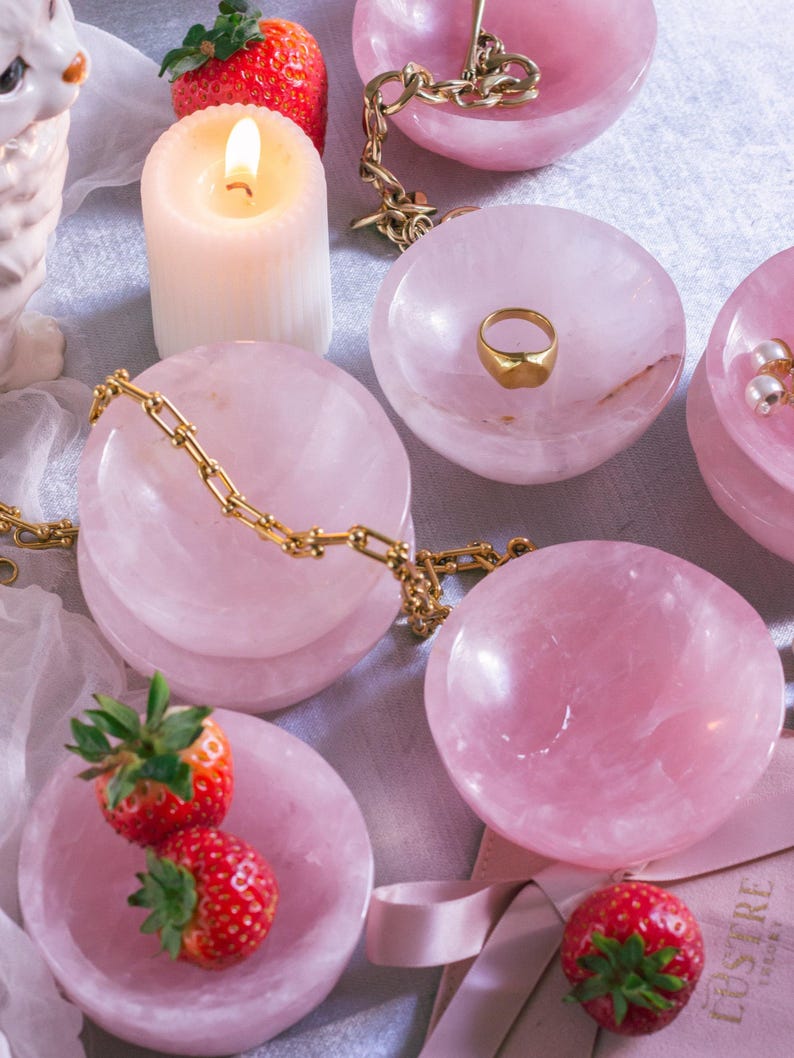Hand-carved 100% natural rose quartz trinket dish with beautiful pink tones, perfect for jewelry or keepsakes.