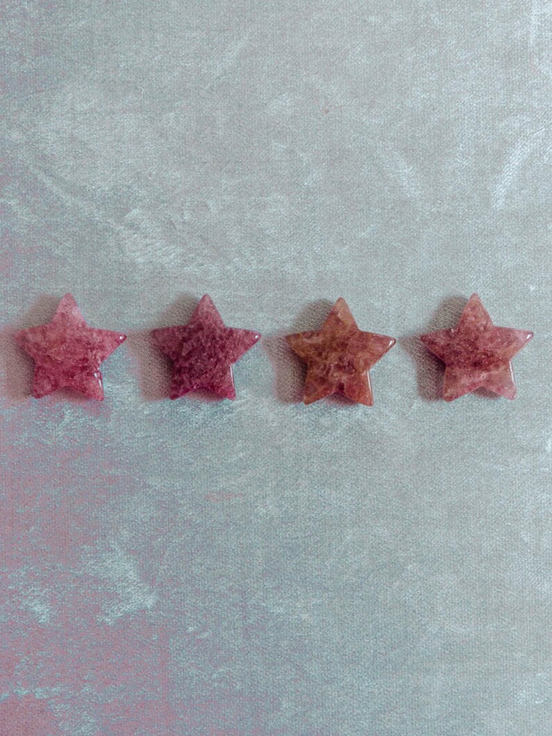 Hand-polished strawberry quartz stars in warm pink tones, ideal for spiritual healing, meditation spaces, or as meaningful gifts that inspire love and positivity.