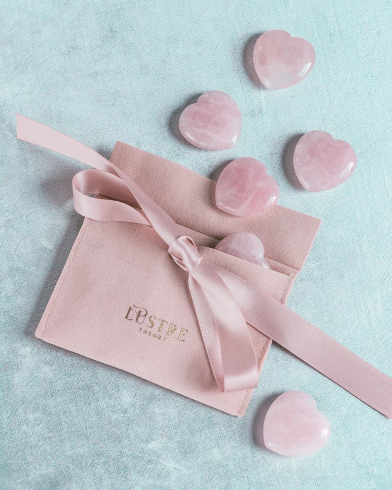 Hand-carved natural rose quartz heart palm stone polished and perfect as a worry stone or meditation tool.