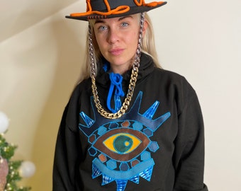 Cozy cotton pullover with a Blue embroidery eye design.