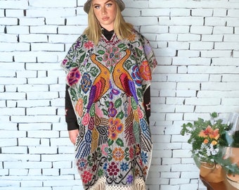 Bright and Bold Floral Peacock Poncho with Fringe Detail.