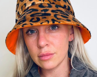 Faux fur leopard reversible orange cotton fabric with wide brim bucket hat.