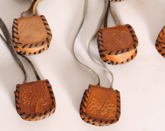 Deadstock 1970s Leather Tooled Cord Mushroom, Bird, Apple, Mouse and Floral Medicine Bag Leather Necklace Snap Pouch