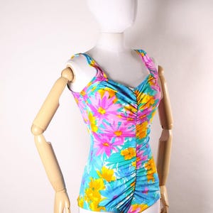 Late 1970s Early 1980s Blue, Pink and Orange Floral Ruched One Piece Swimsuit by Maxine of Hollywood -M-L