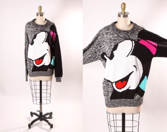 Pull à manches longues noir, blanc, rose et turquoise des années 1990 Pull fantaisie Minnie Mouse par Mickey & Co. -M