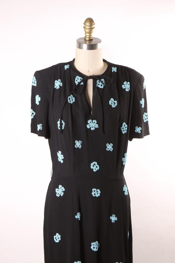 cut out cocktail dress It firstweek_ff_url:https://cdn.shopify.com/s/files/1/2033/1473/files/30629-1-0029_1280x.progressive.jpg?v=1683525281 Color:Dark Tan type closure at the Monsoon Devore Vintage Blue