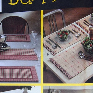 May include: A sewing pattern for placemats and runners. The pattern is titled "Sewing for Dummies" and features a red and white checked design. The pattern includes instructions for making four different placemats and runners, each with a different shape and size.