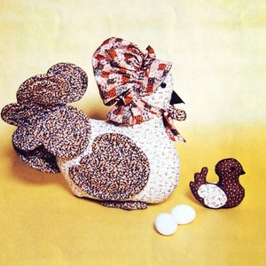 May include: A patchwork pattern for a hen and chick. The hen is 13 inches by 15 inches and the chick is 5 1/2 inches by 6 inches. The pattern includes instructions for making the hen and chick, as well as a list of materials needed.
