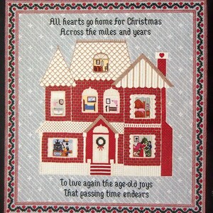 May include: A cross-stitch pattern titled Coming Home featuring a red brick house with multiple rooms, a white roof, and a chimney with a heart. The text reads All hearts go home for Christmas Across the miles and years and To live again the age-old joys That passing time endears.