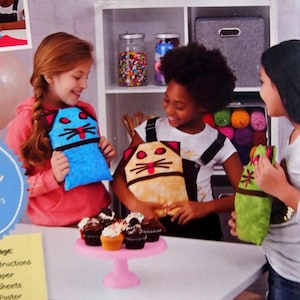 May include: A sewing pattern for making a plush cat toy. The pattern is for beginners and includes instructions, tissue paper, practice sheets, a sewing machine poster, and online video tutorials. The pattern is for ages 8 and up.