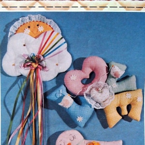 May include: A craft pattern for three wall hangings: a cloud with a rainbow, a heart, and a bird. The pattern is called "Happy Hangings" and is from Patch Press. The pattern includes full-size pieces and easy-to-follow instructions.