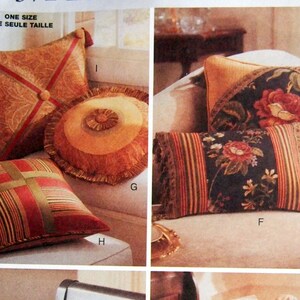 May include: A sewing pattern for pillows with different designs. The pattern includes a round pillow with a tassel, a striped pillow, a floral pillow, and a pillow with a floral design and a tassel. The pattern is from Butterick and is called Waverly.