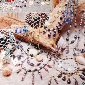 May include: A Leisure Arts craft leaflet titled A Beginner's Guide to Beading, featuring a collection of handmade beaded necklaces, bracelets, and earrings displayed on driftwood and sand, with various shells and a small wooden jewelry box.