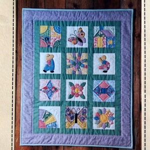 May include: A quilt pattern and instructions for a 30" x 37 1/2" sampler quilt featuring 12 6" blocks reminiscent of the 1930s era. The quilt blocks are designed by Roxy Burgard and quilted by Priscilla Strayer.