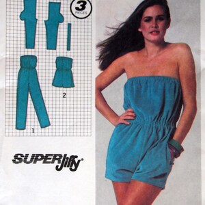 May include: Simplicity 9295 sewing pattern envelope for a strapless romper and pants in size medium 14-16. The front features a photograph of a model wearing a teal strapless romper, along with technical line drawings of the pattern pieces.