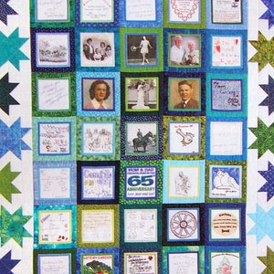 May include: A quilt with a white background and a grid of colorful squares. Each square contains a different image or text. The quilt is surrounded by a border of green, blue, and white stars. The text in the center of the quilt reads "Mom & Dad 65th Anniversary".