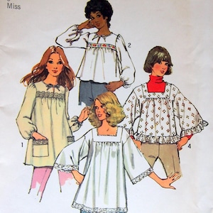 May include: A Simplicity 5341 sewing pattern envelope for Petite 6 Miss tops. The illustration displays four variations of loose-fitting blouses with long or short sleeves, featuring details like lace trim, gathered necklines, and patch pockets.