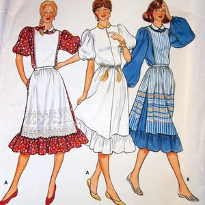 May include: Butterick 4276 sewing pattern featuring three women's dress designs. The dresses have various sleeve styles, skirt lengths, and decorative elements. The pattern includes a size 12. The dresses are in white, red, and blue.
