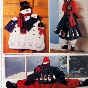 May include: McCall's Crafts pattern featuring snowman-themed decorations. The image shows a variety of snowman designs, including door hangings and a seated snowman. The pattern includes instructions for creating festive holiday decor.