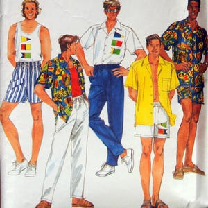 May include: Simplicity sewing pattern featuring various men's summer outfits. The designs include a tank top and shorts, a button-down shirt with blue pants, and a yellow shirt with white shorts. The outfits have colorful flag-like accents.