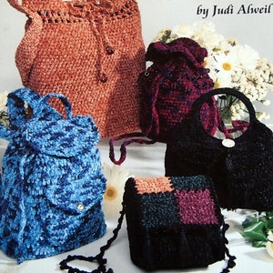 May include: A crochet pattern book titled Chenille Purses by Judi Alweil featuring five handmade bags in various colors including rust, blue, black, and a multi-colored checkered pattern, with drawstring closures and circular handles.