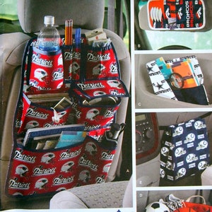 May include: Simplicity pattern 3731 offers car organiser designs. One design is a red and blue seat organiser with a Patriots football team logo. Other designs include sun visors and storage bins with sports team logos.