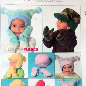 May include: A McCall's Fashion Accessories pattern sheet showing children's fleece hats and mittens. The hats have ear flaps, visors, and playful designs. The text "FABULOUS FLEECE" is visible. The pattern number is M5253.