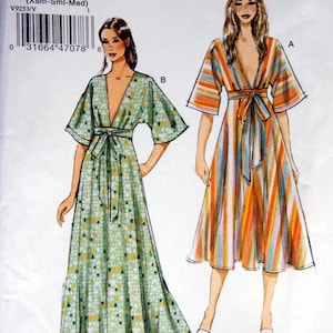 May include: A Very Easy Vogue sewing pattern, V9253, featuring illustrations of two dresses. One dress is green with a geometric pattern, the other is striped in orange, blue, and white. The pattern size is Y (Xsm-Sml-Med).