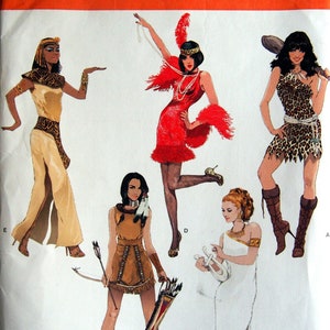 May include: A sewing pattern for five different costumes: an Egyptian, a flapper, a Native American, a Greek, and a cavewoman. The pattern is for sizes 8-16, 34-42, and 36-44.