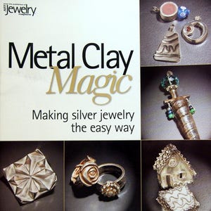 May include: A book titled Metal Clay Magic: Making silver jewelry the easy way by Nana V. Mizushima. The cover features various silver jewelry pieces including pendants, rings, and charms with intricate textures, shapes, and embedded stones.