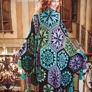May include: A colorful, geometric crochet afghan in shades of black, teal, green, and purple. The afghan features a kaleidoscope pattern and is adorned with tassels. Text on the image reads "leidoscope afghan" and "pattern on page 200."