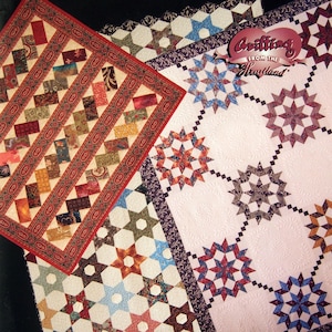 May include: A collection of colorful quilt patterns, including star and geometric designs. The quilts feature various colors and patterns, with the text "Add On to Pandora's Box" and "Quilting from the Heartland" visible. The author's name, Sharlene Jorgenson, is also displayed.