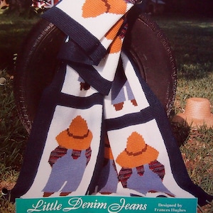 May include: A crochet pattern for a quilt-look afghan called "Little Denim Jeans" from the "Afghan Collector's Series". The pattern features a design of denim-clad figures with orange hats.