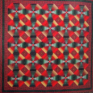 May include: A handmade quilt with a geometric pattern in red, black, green, and gold. The quilt features a repeating design of diamond shapes and a decorative border. The skill level is intermediate to advanced.