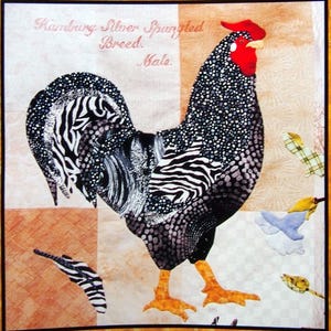May include: A fabric art piece featuring a Hamburg Silver Spangled rooster. The rooster has a red comb and wattle, black and white speckled feathers, and zebra-striped accents. The text "Hamburg Silver Spangled Breed. Male." is in the upper left corner.