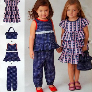 May include: A Cynthia Rowley sewing pattern for girls' clothing, featuring a dress, top, trousers, and purse. The designs include a blue and white polka dot pattern and a pink and blue floral stripe pattern. The pattern size is 1½-4.