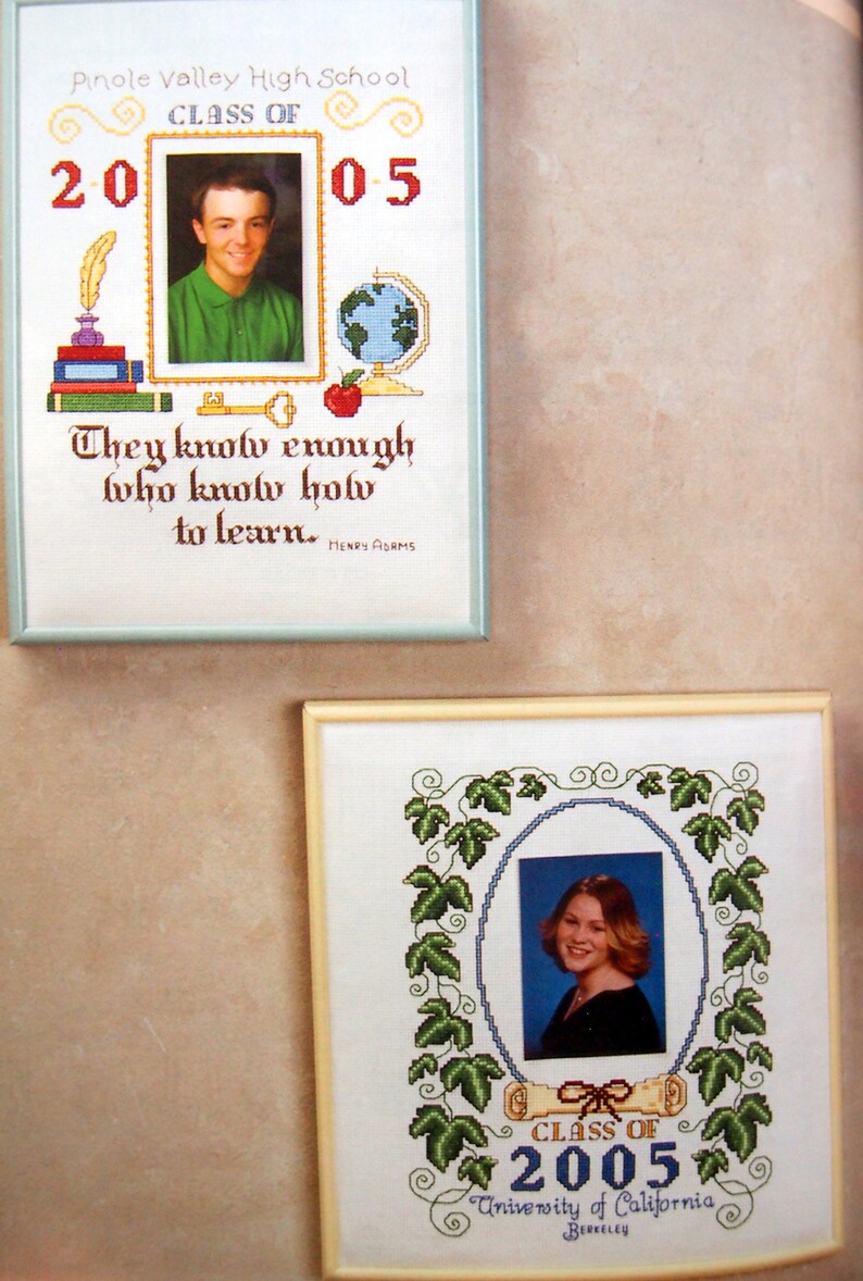 Puede incluir: Dos piezas de bordado de punto de cruz enmarcadas. La pieza superior es blanca con un borde azul y presenta una foto de graduaci&oacute;n de un joven, el texto "Pinole Valley High School", "Class of 2005" y la cita "They know enough who know how to learn. - Henry Adams". La pieza inferior es blanca con un borde crema y presenta una foto de graduaci&oacute;n de una joven, el texto "Class of 2005" y "University of California Berkeley".