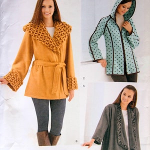 May include: Simplicity sewing pattern 2208 features three different coat designs. One coat is mustard yellow with a textured collar and cuffs. Another is a light blue jacket with black polka dots. The third is a gray wrap coat with black trim.