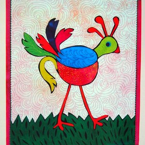 May include: A colorful, whimsical bird quilt with a red, blue, green, and yellow design. The bird is set against a light pink background with a swirling pattern and a green grass border. The quilt measures 13 inches by 15 inches.